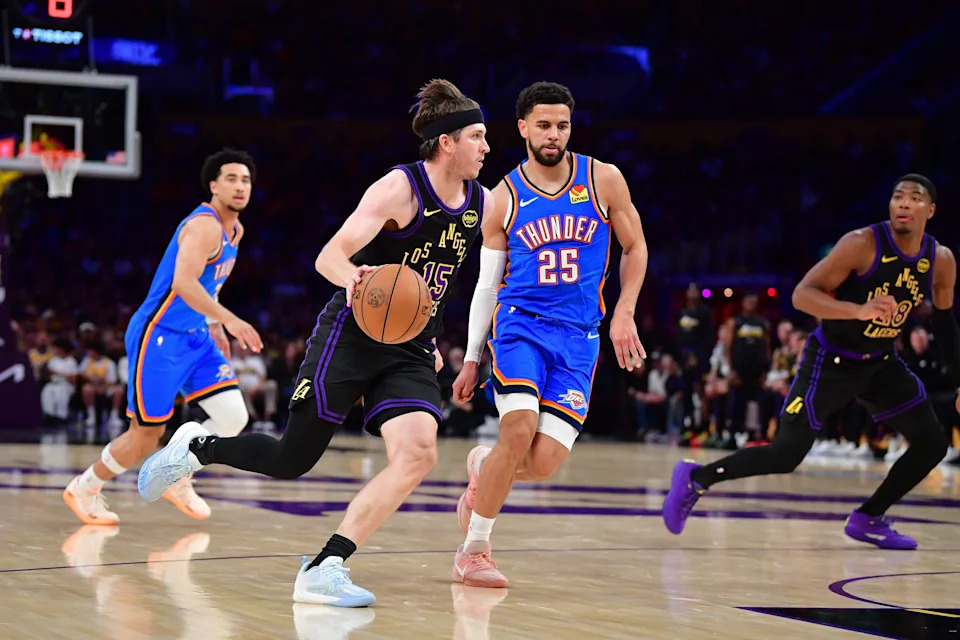 May 11, 2026; Los Angeles, California, USA; Los Angeles Lakers guard Austin Reaves (15) moves the ball against Oklahoma City Thunder guard Ajay Mitchell (25) during the first half in game four of the second round of the 2026 NBA Playoffs at Crypto.com Arena. Mandatory Credit: Gary A. Vasquez-Imagn Images