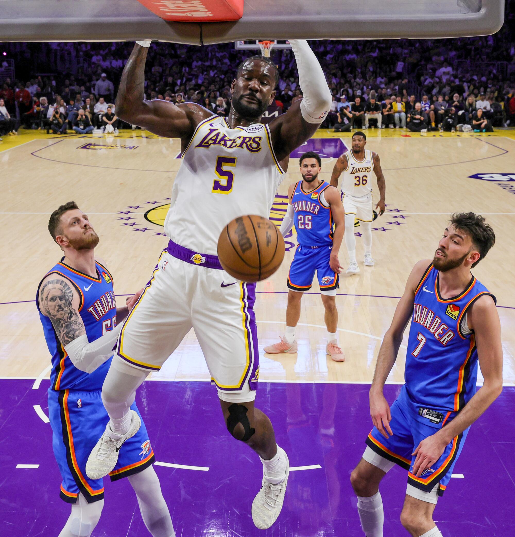 Lakers center Deandre Ayton dunks against the Oklahoma City Thunder in Game 3.