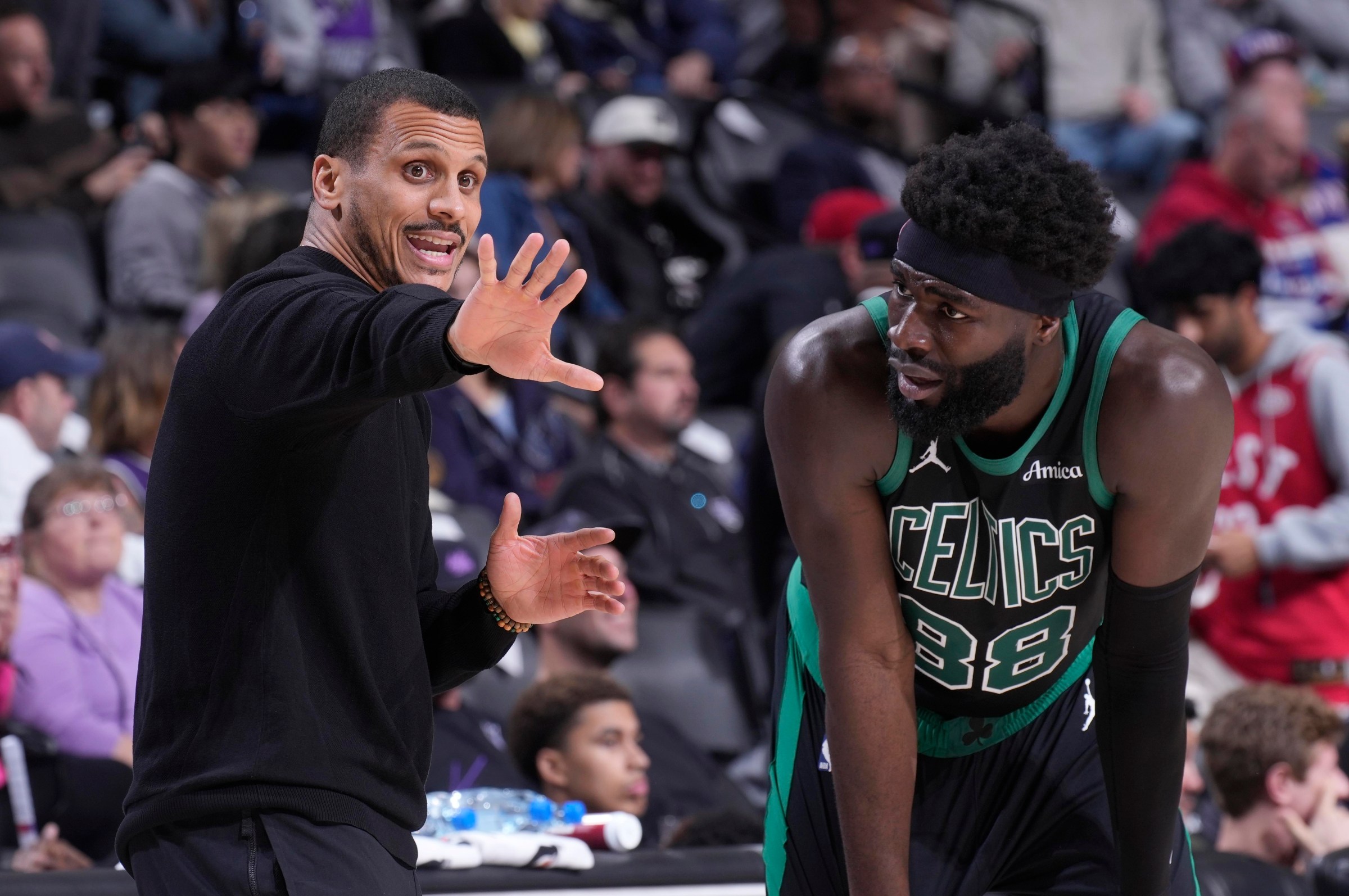 SACRAMENTO, CA - JANUARY 1: Head Coach Joe Mazzulla of the Boston Celtics coaches Neemias Queta #88 during the game against the Sacramento Kings on January 1, 2026 at Golden 1 Center in Sacramento, California. NOTE TO USER: User expressly acknowledges and agrees that, by downloading and or using this photograph, User is consenting to the terms and conditions of the Getty Images Agreement. Mandatory Copyright Notice: Copyright 2026 NBAE (Photo by Rocky Widner/NBAE via Getty Images)