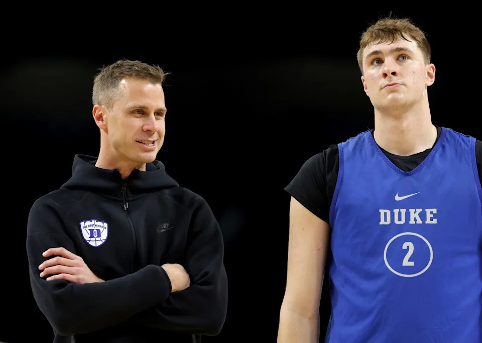 Head Coach Jon Scheyer of the Duke Blue Devils and Cooper Flagg.