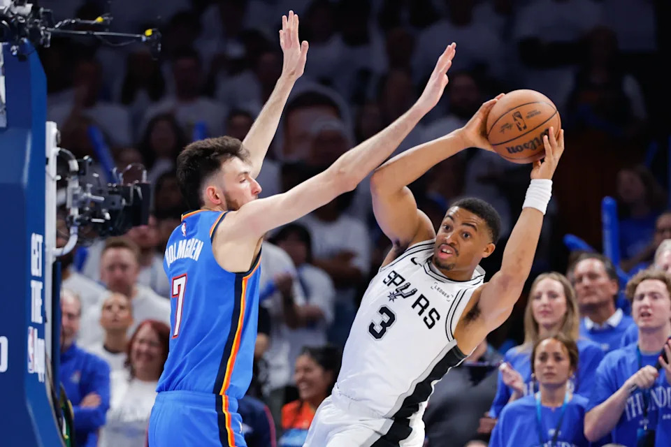 May 20, 2026; Oklahoma City, Oklahoma, USA; San Antonio Spurs forward Keldon Johnson (3) looks to pass as Oklahoma City Thunder center Chet Holmgren (7) defends during the fourth quarter during game two of the western conference finals for the 2026 NBA playoffs at Paycom Center. Mandatory Credit: Alonzo Adams-Imagn Images
