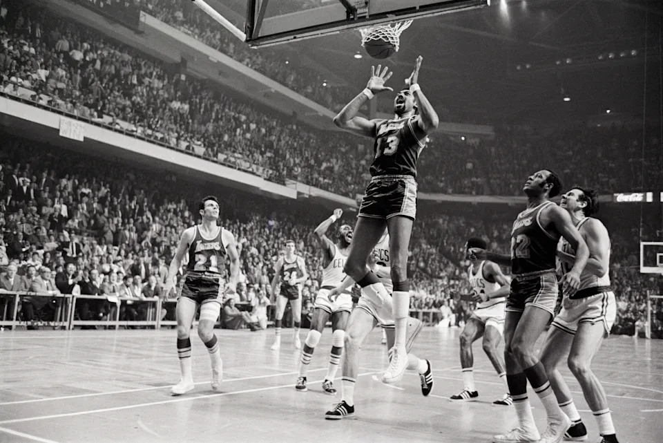 Wilt Chamberlain grimaces as Sam Jones game-winning basket goes through the hoop to win Game 4 of the 1969 NBA Finals. 