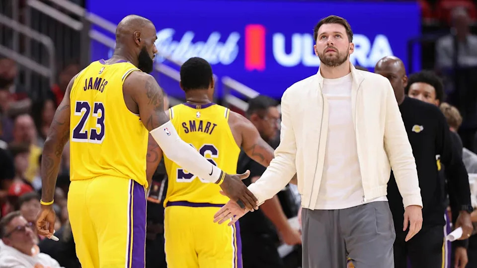 Los Angeles Lakers guard Luka Doncic shakes hands with forward LeBron James during game three of the first round of the 2026 NBA Playoffs.Troy Taormina-Imagn Images