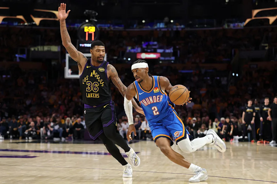 LOS ANGELES, CALIFORNIA - MAY 11: Shai Gilgeous-Alexander #2 of the Oklahoma City Thunder drives against Marcus Smart #36 of the Los Angeles Lakers during the fourth quarter in Game Four of the Second Round of the NBA Western Conference Playoffs at Crypto.com Arena on May 11, 2026 in Los Angeles, California. NOTE TO USER: User expressly acknowledges and agrees that, by downloading and or using this photograph, User is consenting to the terms and conditions of the Getty Images License Agreement. (Photo by Luke Hales/Getty Images)
