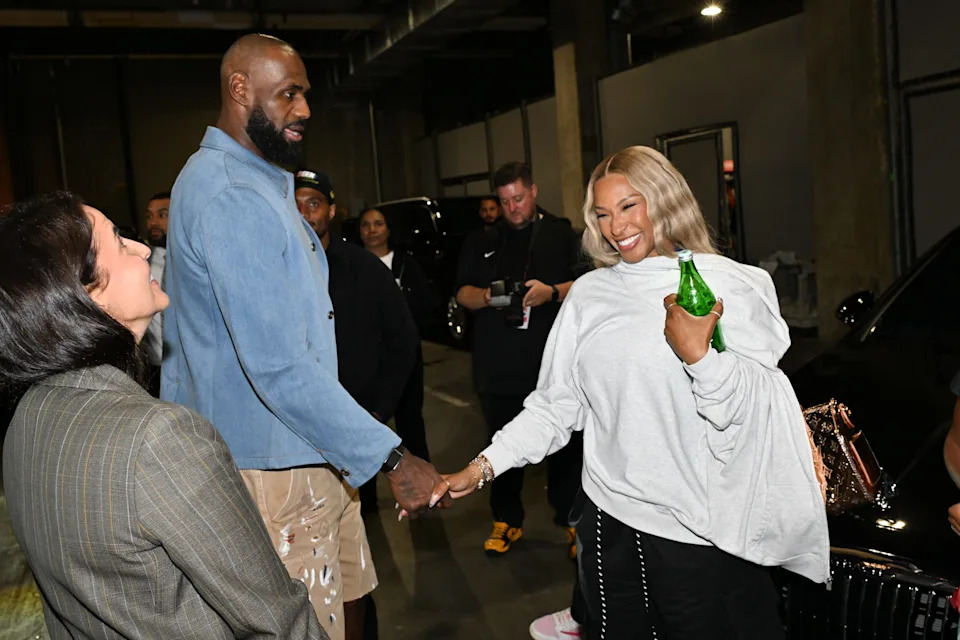 LOS ANGELES, CALIFORNIA - MAY 11: LeBron James #23 of the Los Angeles Lakers interacts with his wife Savannah James after Game Four of the Second Round of the NBA Western Conference Playoffs against the Oklahoma City Thunder at Crypto.com Arena on May 11, 2026 in Los Angeles, California. NOTE TO USER: User expressly acknowledges and agrees that, by downloading and or using this photograph, User is consenting to the terms and conditions of the Getty Images License Agreement. (Photo by Allen Berezovsky/Getty Images)