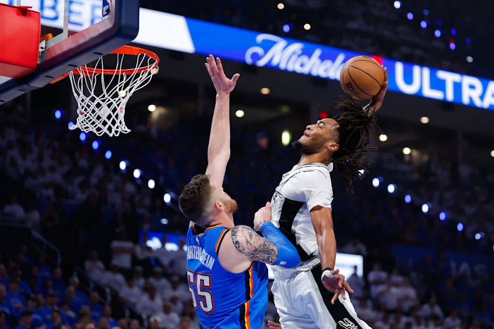 May 20, 2026; Oklahoma City, Oklahoma, USA; San Antonio Spurs guard Stephon Castle (5) dunks over Oklahoma City Thunder center Isaiah Hartenstein (55) during the second quarter during game two of the western conference finals for the 2026 NBA playoffs at Paycom Center. Mandatory Credit: Alonzo Adams-Imagn Images