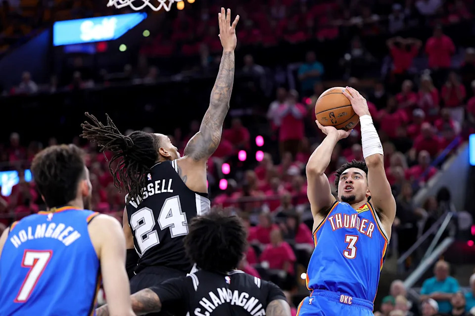 SAN ANTONIO, TEXAS - MAY 22: Jared McCain #3 of the Oklahoma City Thunder shoots the ball against Devin Vassell #24 of the San Antonio Spurs during the fourth quarter in Game Three of the NBA Western Conference Finals at Frost Bank Center on May 22, 2026 in San Antonio, Texas.