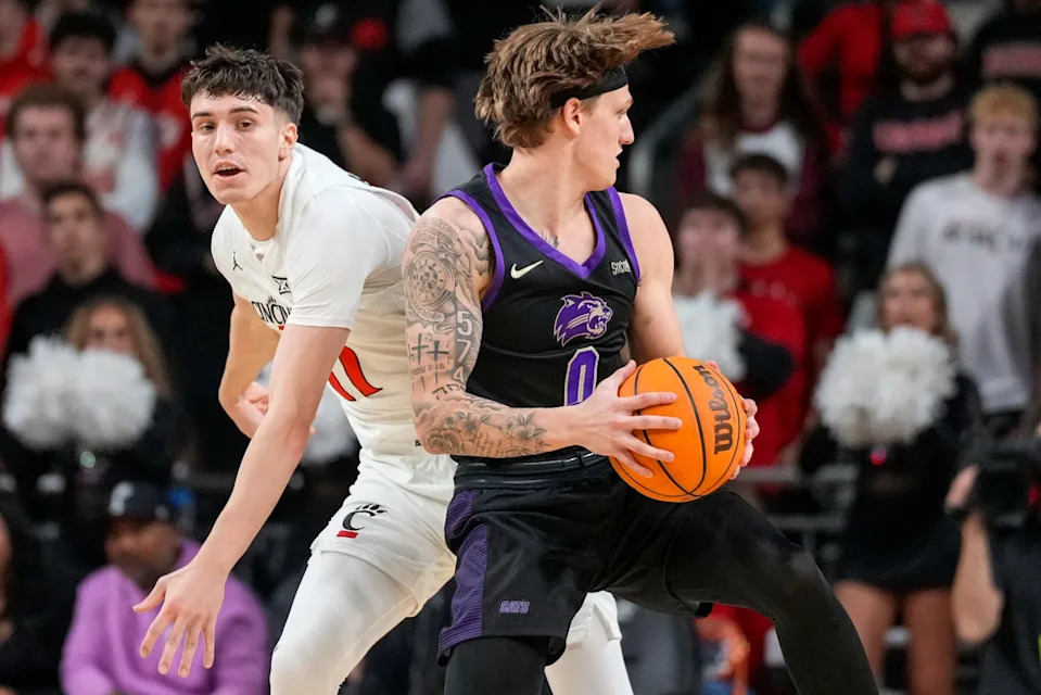 Western Carolina Catamounts guard Cord Stansberry (0) drives against Cincinnati Bearcats guard Jordi Rodriguez (17) in the first half of the NCAA men’s basketball game between the Cincinnati Bearcats and the Western Carolina Catamounts at Fifth Third Arena in Cincinnati on Monday, Nov. 3, 2025.