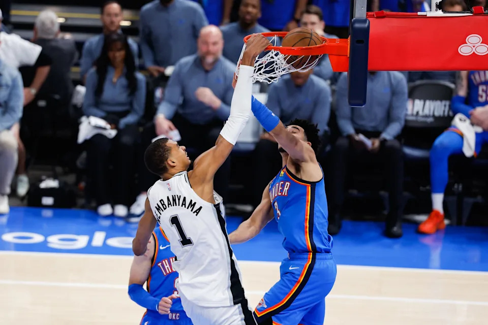 May 20, 2026; Oklahoma City, Oklahoma, USA; San Antonio Spurs forward Victor Wembanyama (1) dunks over Oklahoma City Thunder guard Jared McCain (3) during the third quarter during game two of the western conference finals for the 2026 NBA playoffs at Paycom Center. Mandatory Credit: Alonzo Adams-Imagn Images