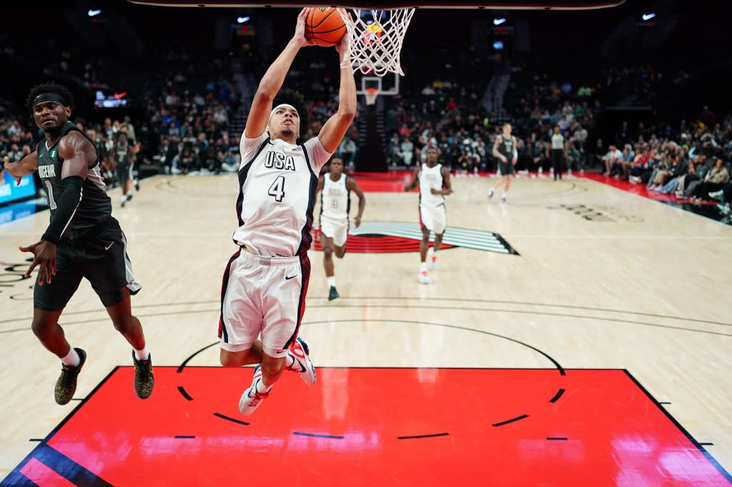 Tyran Stokes of Team USA attempts a dunk past Ikenna Alozie of the Team World during the second half at Moda Center on April 11, 2026 in Portland. Getty Images