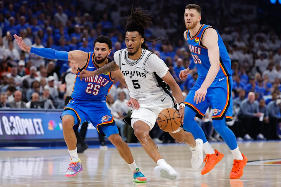 May 20, 2026; Oklahoma City, Oklahoma, USA; San Antonio Spurs guard Stephon Castle (5) drives to the basket as Oklahoma City Thunder guard Ajay Mitchell (25) defends during the second quarter during game two of the western conference finals for the 2026 NBA playoffs at Paycom Center. Mandatory Credit: Alonzo Adams-Imagn Images