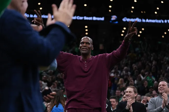 Mar 18, 2026; Boston, Massachusetts, USA; Former Boston Celtics player Robert Parish reacts to the crowd during a break against the Golden State Warriors in the first quarter at TD Garden. Mandatory Credit: David Butler II-Imagn Images