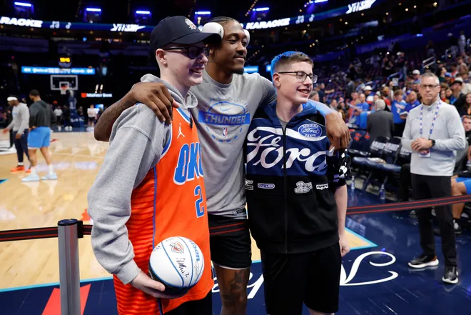 Apr 22, 2026; Oklahoma City, Oklahoma, USA; Oklahoma City Thunder guard Jalen Williams (8) poses for a photo with fans before game two of the first round of the 2026 NBA Playoffs at Paycom Center. Mandatory Credit: Alonzo Adams-Imagn Images