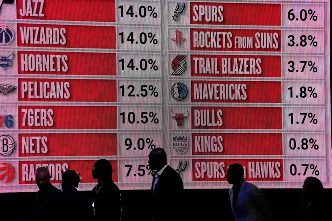 May 12, 2025; Chicago, Illinois, US; Representitives of the NBA teams walk onto the stage during the 2025 NBA Draft Lottery at McCormick Place. Mandatory Credit: David Banks-Imagn Images