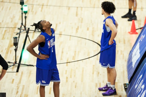 Darryn Peterson looks up at results while he waits to participate in a drill during the NBA draft combine Tuesday, May 12, 2026, at Wintrust Arena. (Eileen T. Meslar/Chicago Tribune)