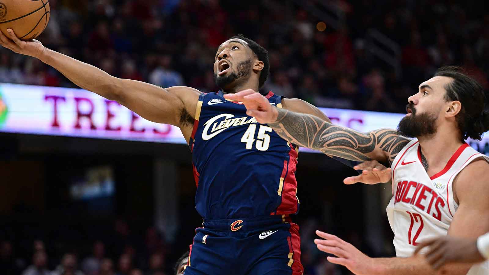 Cleveland Cavaliers guard Donovan Mitchell (45) goes to the basket against Houston Rockets center Steven Adams (12) during the second half at Rocket Arena. 