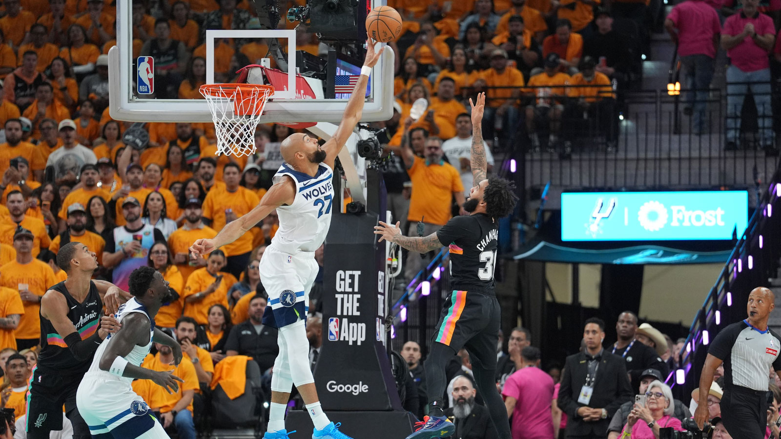 Minnesota Timberwolves center Rudy Gobert (27) blocks a shot by San Antonio Spurs forward Julian Champagnie (30) in the first half during game one of the second round of the 2026 NBA Playoffs at Frost Bank Center. 