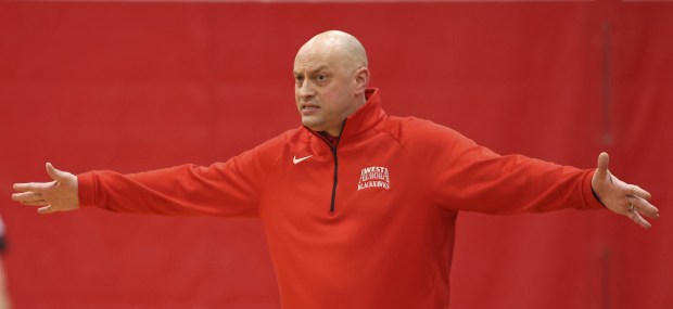West Aurora coach Brian Johnson directs his players against Metea Valley during a game in the Aurora vs. Cancer Night of Hoops at Aurora Christian on Saturday, Jan. 21, 2023.
