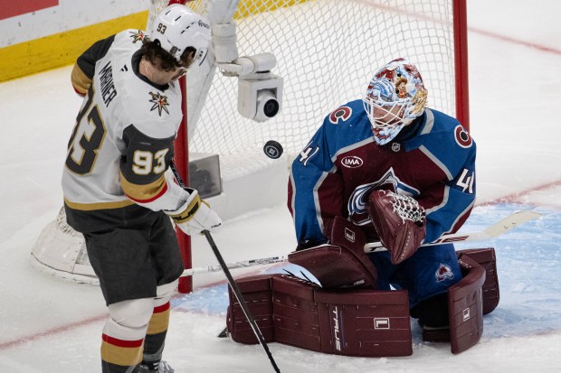 Goaltender Scott Wedgewood (41) of the Colorado Avalanche deflects a shot while right wing Mitch Marner (93) of the Vegas Golden Knights looks on during the second period of Game 2 of the Western Conference Finals of the Stanley Cup Playoffs on Friday, May 22, 2026, at Ball Arena in Denver. (Photo by Timothy Hurst/The Denver Post)