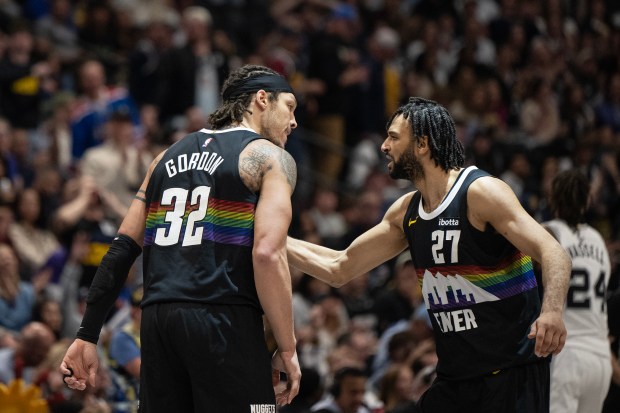 Guard Jamal Murray (27) of the Denver Nuggets greets forward Aaron Gordon (32) of the Denver Nuggets after Jordan hit a three during the second half of a 136-134 overtime Nuggets win on Saturday, April 4, 2026, at Ball Arena in Denver. (Photo by Timothy Hurst/The Denver Post)