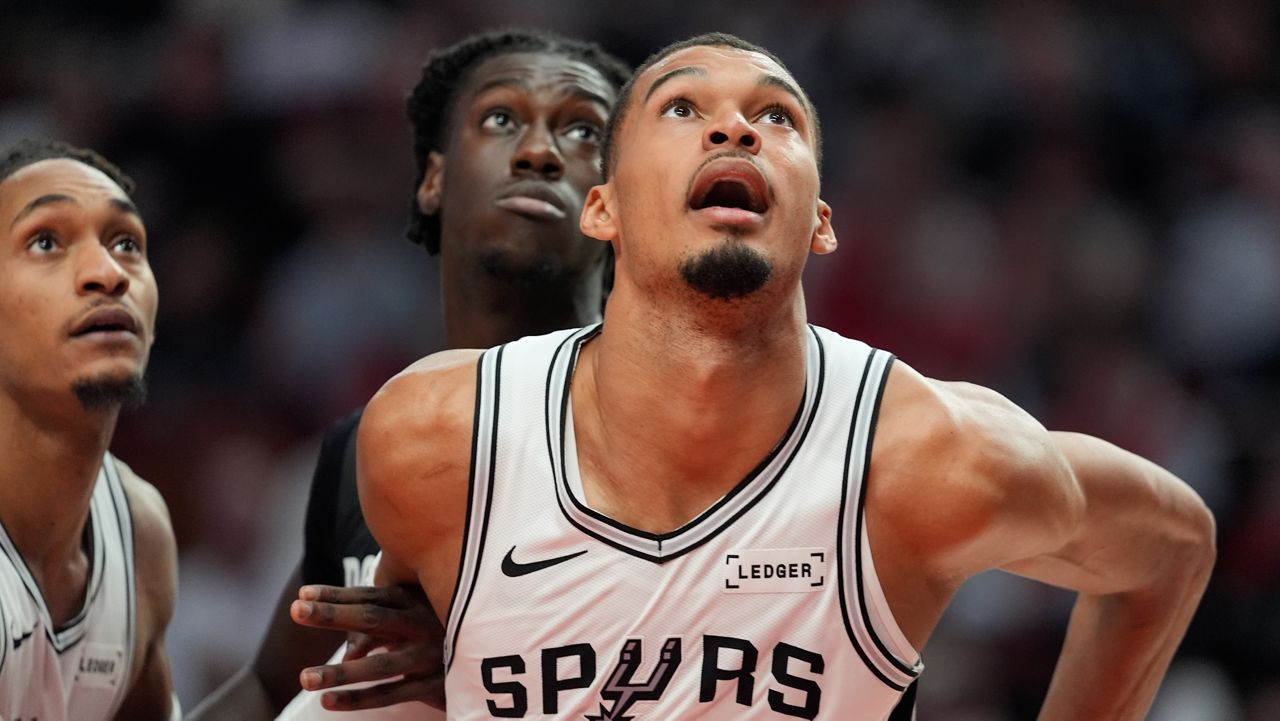 San Antonio Spurs forward/center Victor Wembanyama (1) and Portland Trail Blazers guard Sidy Cissoko watch for the rebound during the second half in Game 4 of a first-round NBA basketball playoffs series in Portland, Ore., Sunday, April 26, 2026. (AP Photo/Jenny Kane)