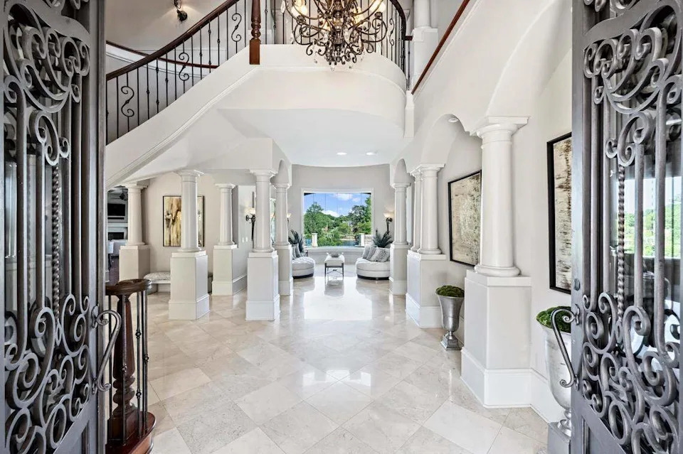 The mansion includes “extensive architectural detailing, soaring ceilings and custom millwork,” Michelle Rhyne, global real estate adviser with Premier Sotheby’s Lake Norman office said in a statement.