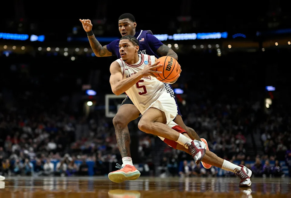 Mar 21, 2026; Portland, OR, USA; Arkansas Razorbacks guard Darius Acuff Jr. (5) drives against High Point Panthers forward Cam'ron Fletcher (11) in the second half during a second round game of the men's 2026 NCAA Tournament at Moda Center. Mandatory Credit: Troy Wayrynen-Imagn Images