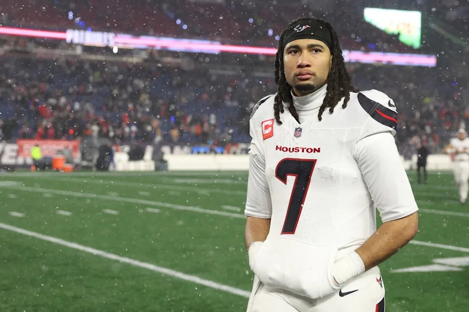 C.J. Stroud #7 of the <a class="link " href="https://sports.yahoo.com/nfl/teams/houston/" data-i13n="sec:content-canvas;subsec:anchor_text;elm:context_link" data-ylk="slk:Houston Texans;sec:content-canvas;subsec:anchor_text;elm:context_link;itc:0" data-yga="{"yLinkElement":"context_link","yModuleName":"content-canvas","yLinkText":"Houston Texans","ySubModuleName":"anchor_text","yHasCommerce":false}">Houston Texans</a> reacts after a 28-16 loss against the <a class="link " href="https://sports.yahoo.com/nfl/teams/new-england/" data-i13n="sec:content-canvas;subsec:anchor_text;elm:context_link" data-ylk="slk:New England Patriots;sec:content-canvas;subsec:anchor_text;elm:context_link;itc:0" data-yga="{"yLinkElement":"context_link","yModuleName":"content-canvas","yLinkText":"New England Patriots","ySubModuleName":"anchor_text","yHasCommerce":false}">New England Patriots</a> in the AFC Divisional Playoff game at Gillette Stadium on January 18, 2026 in Foxborough, Massachusetts. Getty Images