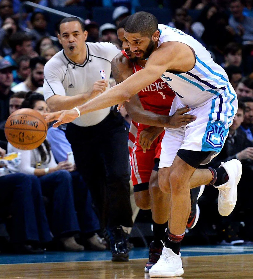 Charlotte Hornets guard Nicolas Batum chases after a loose ball in a game against the Houston Rockets at Spectrum Center on Feb. 9, 2017.