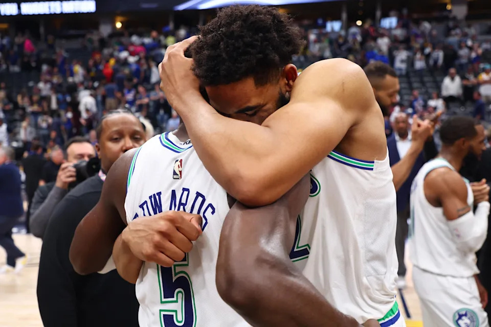 DENVER, COLORADO – MAY 19: <a class="link " href="https://sports.yahoo.com/nba/players/5432/" data-i13n="sec:content-canvas;subsec:anchor_text;elm:context_link" data-ylk="slk:Karl-Anthony Towns;sec:content-canvas;subsec:anchor_text;elm:context_link;itc:0" data-yga="{"yLinkElement":"context_link","yModuleName":"content-canvas","yLinkText":"Karl-Anthony Towns","ySubModuleName":"anchor_text","yHasCommerce":false}">Karl-Anthony Towns</a> #32 and Anthony Edwards #5 of the Minnesota Timberwolves hug after winning Game Seven of the Western Conference Second Round Playoffs against the Denver Nuggets at Ball Arena on May 19, 2024 in Denver, Colorado. NOTE TO USER: User expressly acknowledges and agrees that, by downloading and or using this photograph, User is consenting to the terms and conditions of the Getty Images License Agreement. (Photo by C. Morgan Engel/Getty Images) | Getty Images