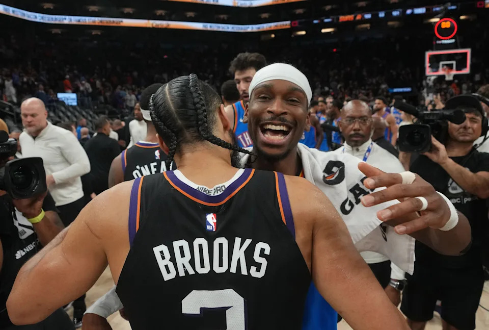 Phoenix Suns forward Dillon Brooks (3) embraces Oklahoma City Thunder guard Shai Gilgeous-Alexander (2) after Game 4 of their playoff series at the Mortgage Matchup Center in Phoenix on April 27, 2026.