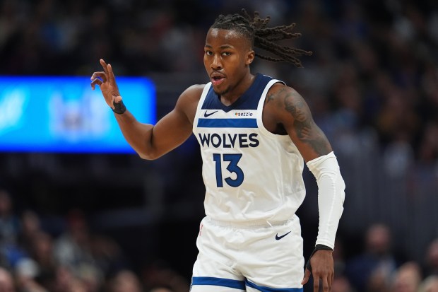Minnesota Timberwolves guard Ayo Dosunmu gestures after hitting a 3-point basket against the Denver Nuggets in the first half in Game 5 of a first-round NBA playoffs basketball series Monday, April 27, 2026, in Denver. (AP Photo/David Zalubowski)