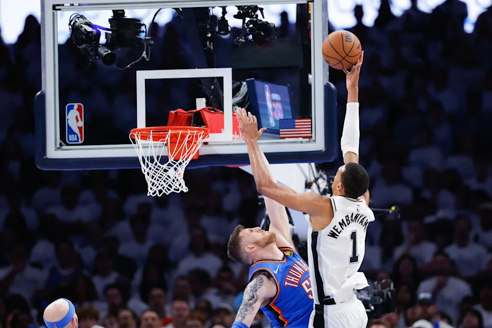 May 20, 2026; Oklahoma City, Oklahoma, USA; San Antonio Spurs forward Victor Wembanyama (1) shoots as Oklahoma City Thunder center Isaiah Hartenstein (55) defends during the fourth quarter during game two of the western conference finals for the 2026 NBA playoffs at Paycom Center. Mandatory Credit: Alonzo Adams-Imagn Images