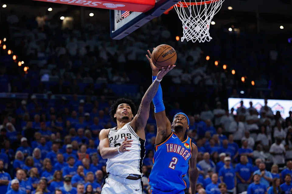 May 20, 2026; Oklahoma City, Oklahoma, USA; San Antonio Spurs guard Dylan Harper (2) shoots a lay up as Oklahoma City Thunder guard Shai Gilgeous-Alexander (2) defends during the second quarter during game two of the western conference finals for the 2026 NBA playoffs at Paycom Center. Mandatory Credit: Alonzo Adams-Imagn Images