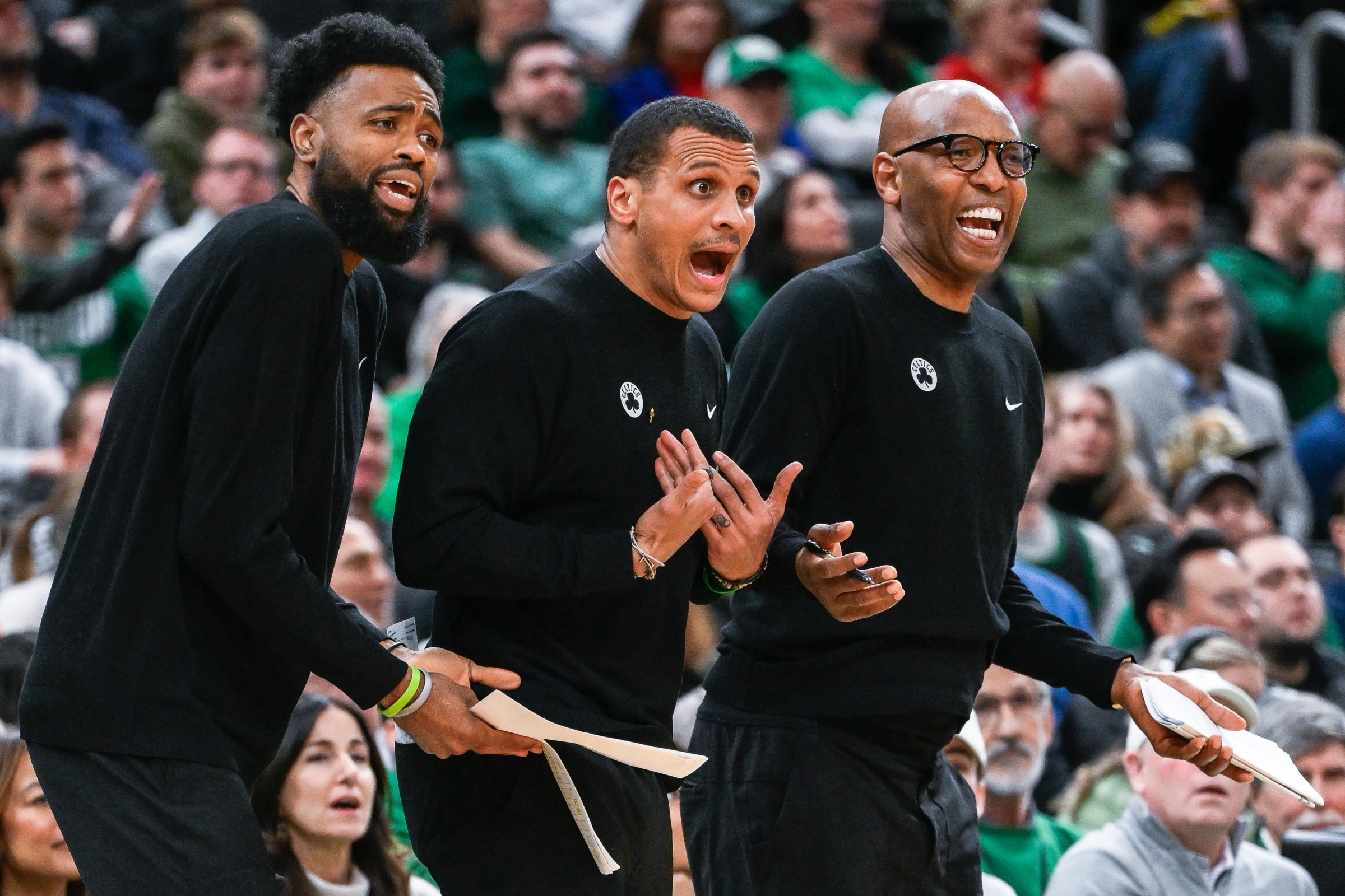 Boston, MA - December 19: Boston Celtics assistant coach Tony Dobbins, head coach Joe Mazzulla, and assistant coach Sam Cassell react to a technical foul call on Mazzulla in the fourth quarter. (Photo by Andrew Burke-Stevenson/The Boston Globe via Getty Images)