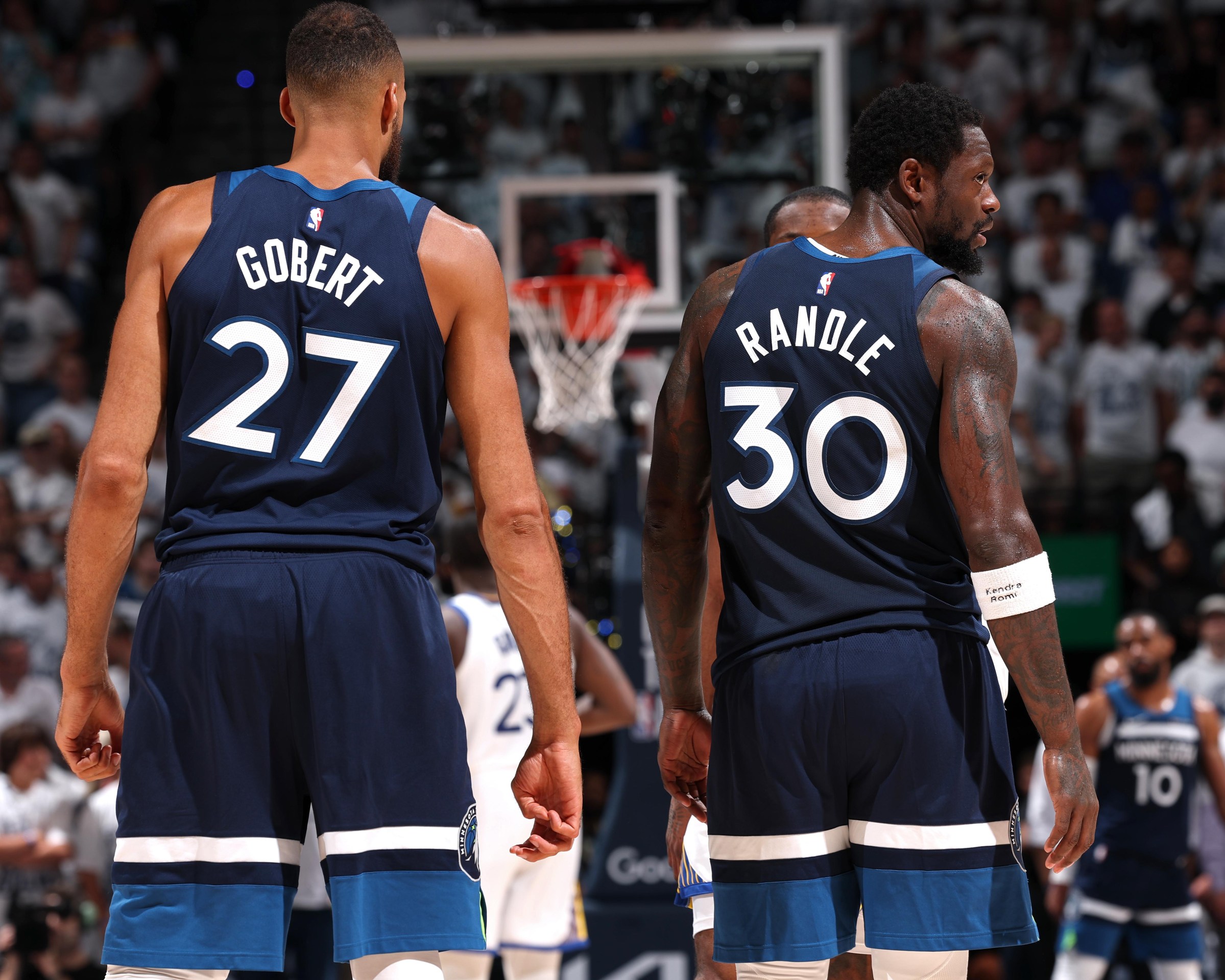 MINNEAPOLIS, MN - MAY 14: Rudy Gobert #27 and Julius Randle #30 of the Minnesota Timberwolves look on during the game against the Golden State Warriors during Round 2 Game 5 of the 2025 NBA Playoffs on May 14, 2025 at Target Center in Minneapolis, Minnesota. NOTE TO USER: User expressly acknowledges and agrees that, by downloading and or using this Photograph, user is consenting to the terms and conditions of the Getty Images License Agreement. Mandatory Copyright Notice: Copyright 2025 NBAE(Photo by David Sherman/NBAE via Getty Images)