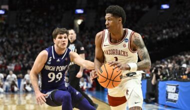 Mar 21, 2026; Portland, OR, USA; Arkansas Razorbacks guard Meleek Thomas (1) drives against High Point Panthers guard Chase Johnston (99) in the first half during a second round game of the men's 2026 NCAA Tournament at Moda Center. Mandatory Credit: Craig Strobeck-Imagn Images