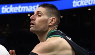 Apr 10, 2026; Boston, Massachusetts, USA; Boston Celtics center Nikola Vucevic (4) tries to knock the ball away from New Orleans Pelicans center Derik Queen (22) during the second half at TD Garden. Mandatory Credit: Winslow Townson-Imagn Images