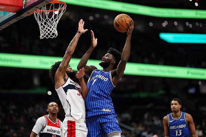 Orlando Magic v Washington Wizards WASHINGTON, DC - JANUARY 06: Jonathan Isaac #1 of the Orlando Magic goes to the basket against Marvin Bagley III #35 of the Washington Wizards during the second half at Capital One Arena on January 6, 2026 in Washington, DC. NOTE TO USER: User expressly acknowledges and agrees that, by downloading and or using this photograph, User is consenting to the terms and conditions of the Getty Images License Agreement. (Photo by Scott Taetsch/Getty Images)