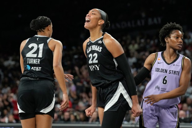 Las Vegas Aces center A'ja Wilson (22) celebrates after a play against the Golden State Valkyries during the second half of a WNBA basketball game Sunday, June 21, 2026, in Las Vegas. (AP Photo/John Locher)