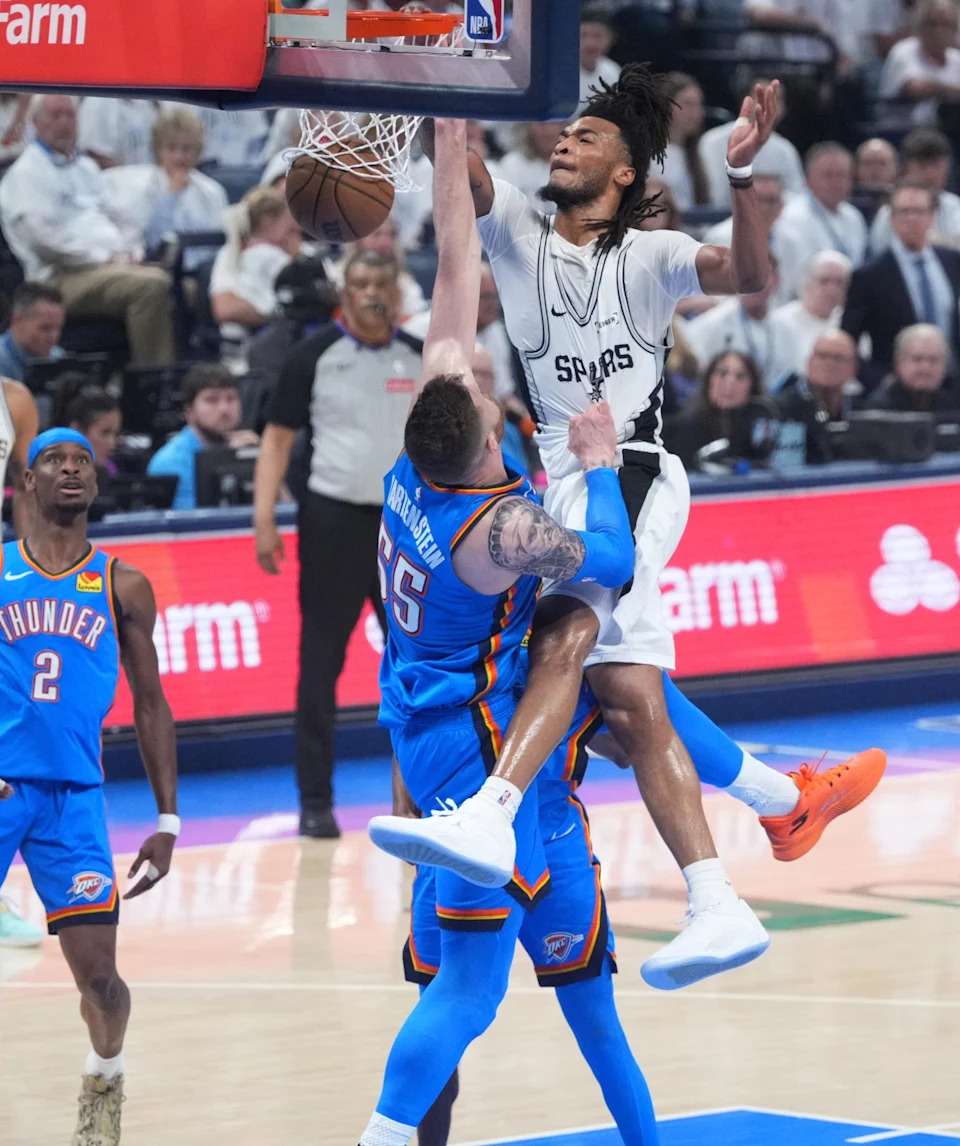 San Antonio Spurs guard Stephon Castle (5) dunks over Oklahoma City Thunder center Isaiah Hartenstein (55) during Game 2 of the Western Conference Finals between the Oklahoma City Thunder and the San Antonio Spurs at Paycom Center in Oklahoma City, Wednesday, May 20, 2026. Oklahoma City won 122-113.