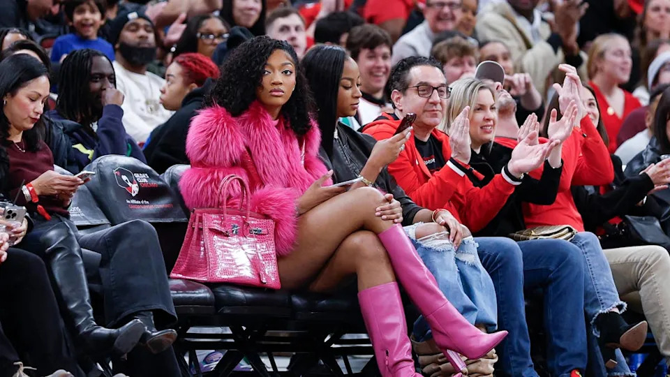 Angel Reese watches an NBA game between the <a class="link " href="https://sports.yahoo.com/nba/teams/chicago/" data-i13n="sec:content-canvas;subsec:anchor_text;elm:context_link" data-ylk="slk:Chicago Bulls;sec:content-canvas;subsec:anchor_text;elm:context_link;itc:0" data-yga="{"yLinkElement":"context_link","yModuleName":"content-canvas","yLinkText":"Chicago Bulls","ySubModuleName":"anchor_text","yHasCommerce":false}">Chicago Bulls</a> and Orlando Magic.Kamil Krzaczynski-Imagn Images