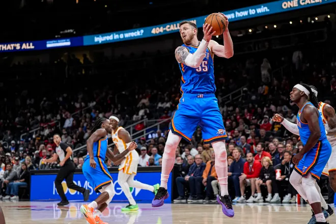 Oct 25, 2025; Atlanta, Georgia, USA; Oklahoma City Thunder center Isaiah Hartenstein (55) grabs a rebound against the Atlanta Hawks during the first half at State Farm Arena. Mandatory Credit: Dale Zanine-Imagn Images