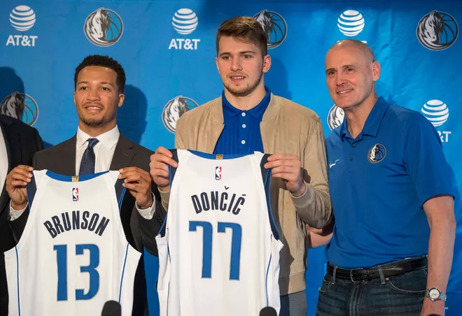Dallas Mavericks second round pick Jalen Brunson, point guard Villanova (left) and first round pick Luka Doncic, guard Slovenia (center) and head coach Rick Carlisle (right).
