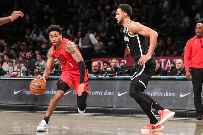 Portland Trail Blazers guard Anfernee Simons (1) attempts to drive past Brooklyn Nets guard Ben Simmons (10) in the first quarter at Barclays Center.
