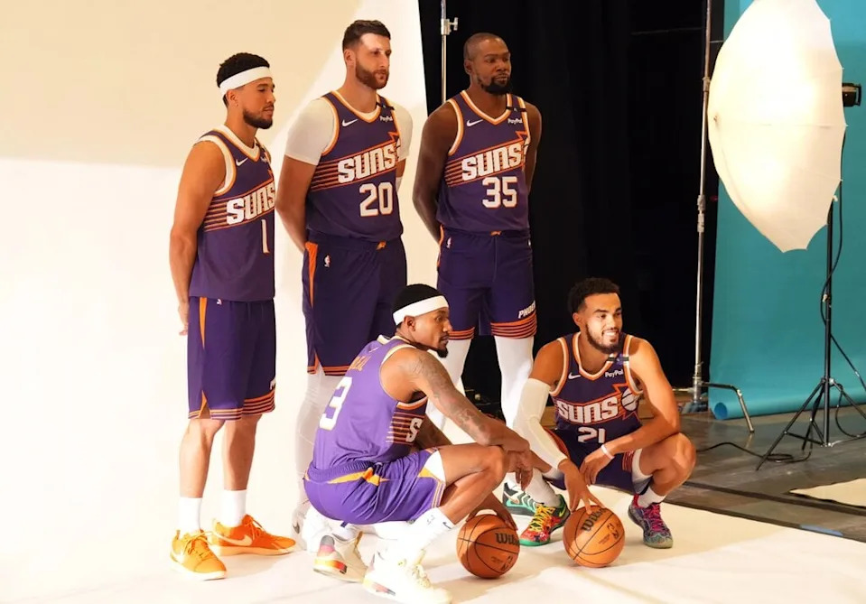 Sep 30, 2024; Phoenix, AZ, USA; Phoenix Suns guard Devin Booker (1) and Phoenix Suns center Jusuf Nurkic (20) and Phoenix Suns forward Kevin Durant (35) and Phoenix Suns guard Bradley Beal (3) and Phoenix Suns guard Tyus Jones (21) pose for a photo during Media Day at Footprint Center. Mandatory Credit: Joe Camporeale-Imagn Images