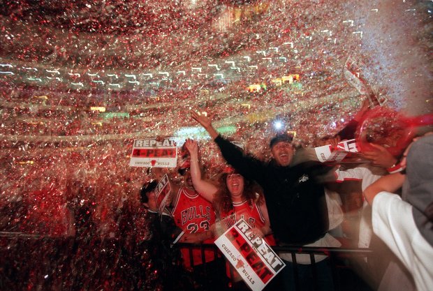 Fans celebrate at the United Center in Chicago after the Chicago Bulls won an NBA title the team's sixth against the Utah Jazz on June 14, 1998. (John Lee/Chicago Tribune)