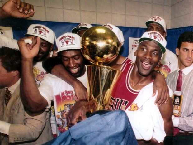 Michael Jordan celebrates the Chicago Bulls' third NBA title with his teammates on June 20, 1993, in Phoenix. (Jim Prisching/Chicago Tribune)