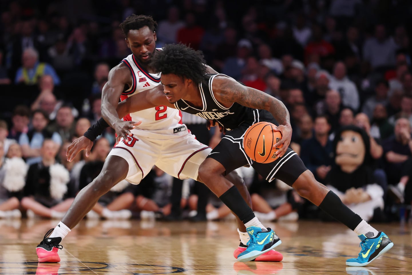 Jaylin Sellers #2 of the Providence Friars dribbles against Sadiku Ibine Ayo #2 of the St. John's Red Storm during the second half of the 2026 Big East Men's Tournament - Quarterfinal game at Madison Square Garden on March 12, 2026 in New York City.