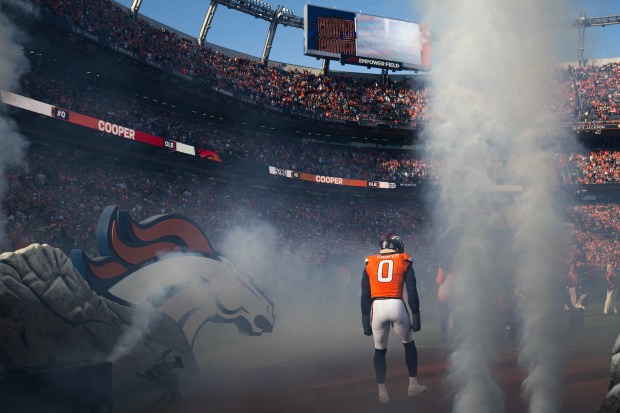 linebacker Jonathon Cooper (0) of the Denver Broncos runs onto the field before a game against the Green Bay Packers on Sunday, Dec. 14, 2025, at Empower Field at Mile High Stadium in Denver. (Photo by Timothy Hurst/The Denver Post)